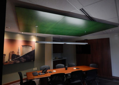 dimly lit conference room with table and chairs